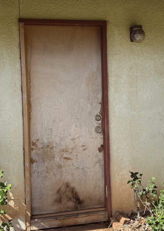The Cost To Fix Up A Rundown Two-Bedroom In-Law Unit - decrepit exterior door with termites that needed to be replaced